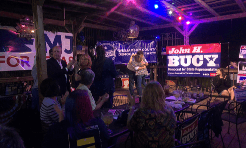 Election Watch Party event photo, Kim Gilby hugging John Bucy upon his win