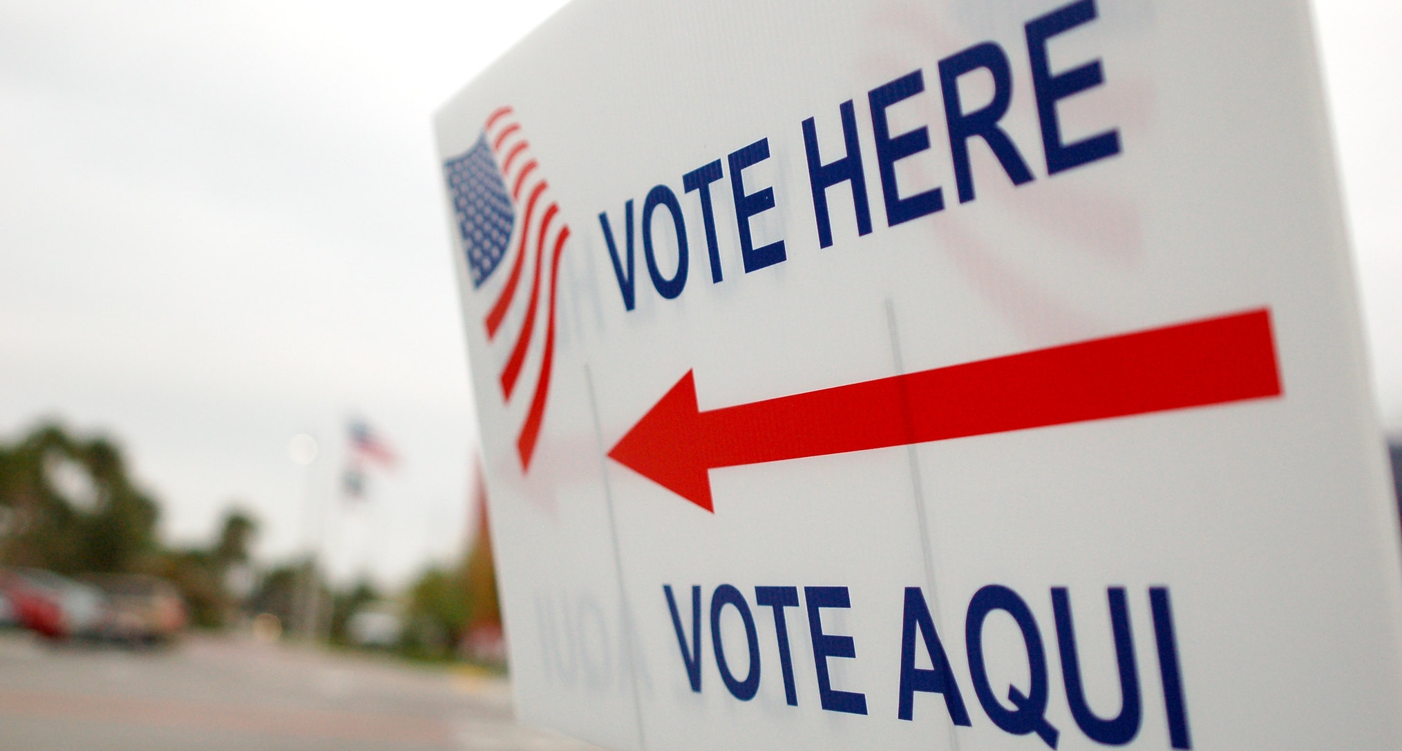 "Vote here, vote aqui" by whiteafrican is licensed under CC BY 2.0.